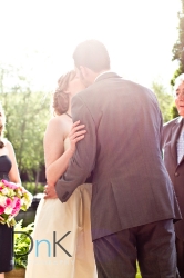 Lens Flare Bride and Groom Kiss Minneapolis Wedding Photography