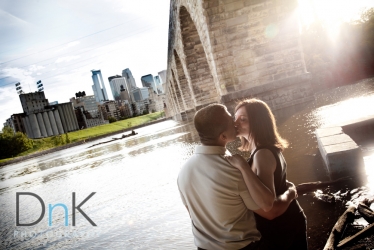 lens flare under stone arch bridge artistic engagement session