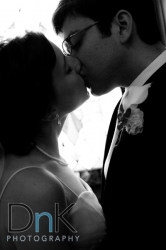 bride and groom kissing portrait