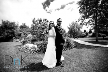 silly serious black and white bride and groom picture