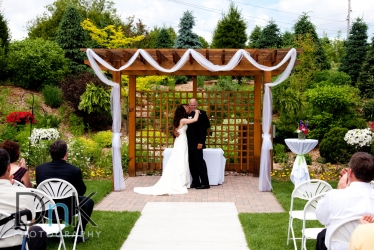 florian gardens wedding ceremony kiss