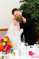 bride and groom kiss
