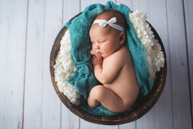 newborn baby portrait in a basket